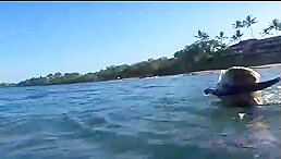 Haley, one of the ATK Girlfriends, swims with the turtles and gets up close and personal with them.   Blonde white woman in a 4K bikini wearing flip flops at the beach   nails painted on both hands and feet long hair pee sho